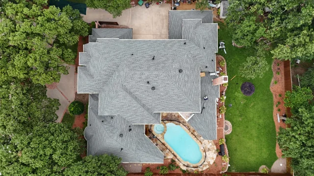 Overhead view of the same slate roof beside a pool